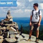 Senior Transportation Planner Colin Lentz poses at the top of a mountain for his submitted photo for his "Get to Know Team SRPC" blog feature