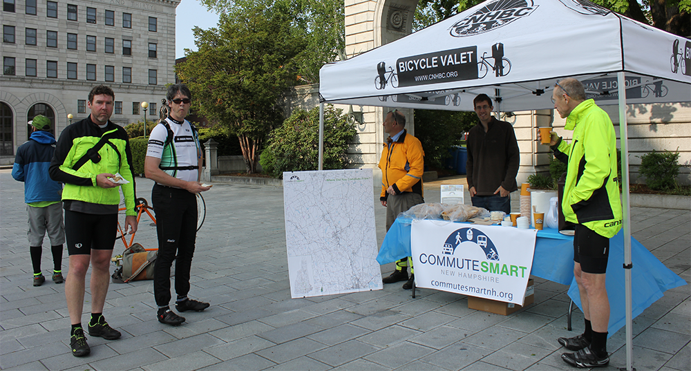 CSNH staff provide breakfast to bike commuters in front of the Capitol during bike walk to work week in May.