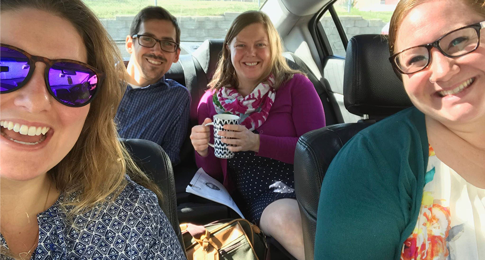 Four SRPC staff pose for a photo in a car after carpooling to work during the CommuteSmart NH statewide challenge.