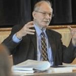 SRPC Commissioner Ed Jansen animatedly speaking at a meeting