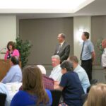 Executive Director Cynthia Copeland present the 2016 planning award to the UNH Planning Department
