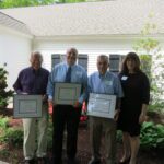 SRPC Executive Director Cynthia Copeland poses with the winners of the annual award in from of the Madbury Town Hall