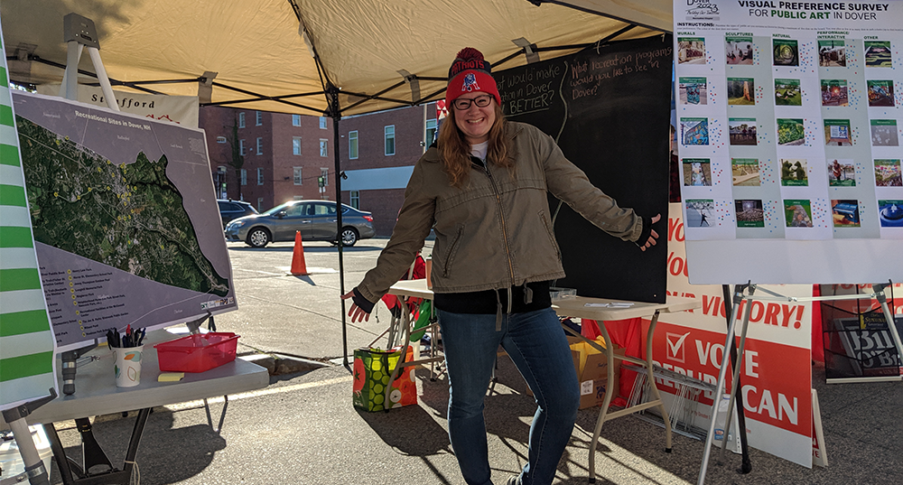 SRPC staff poses with outreach posters at Dover Apple Harvest Day