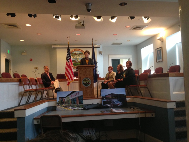Senator Shaheen stands at podium to announce Rochesters EDA grant at event in Rochester's City Council Chambers